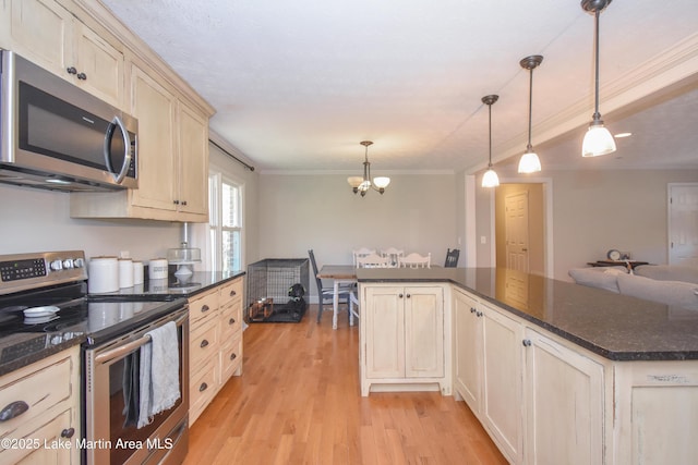 241 Warrior Rd, Alexander City, AL 35010 - kitchen with light wood finished floors, crown molding, pendant lighting, appliances with stainless steel finishes, and a notable chandelier