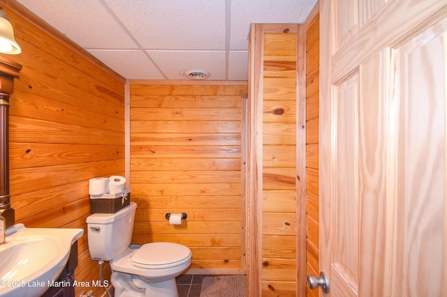 241 Warrior Rd, Alexander City, AL 35010 - half bathroom with toilet, visible vents, and wood walls