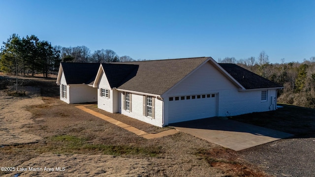 view of side of home featuring a garage