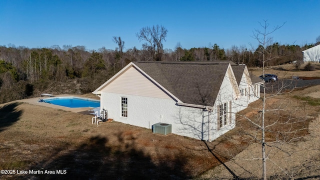 view of side of property featuring central AC unit