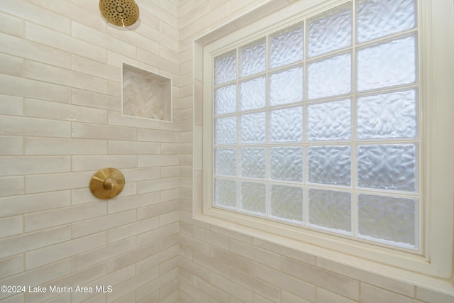 bathroom with a tile shower