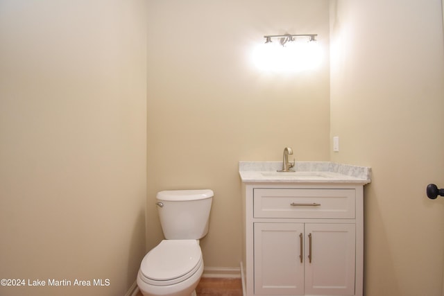 bathroom with toilet and vanity