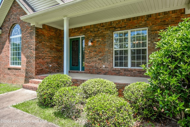 doorway to property featuring covered porch