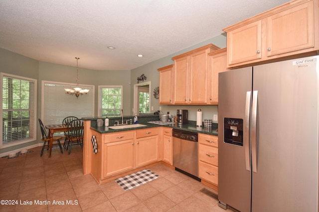 kitchen featuring kitchen peninsula, appliances with stainless steel finishes, sink, light brown cabinets, and light tile patterned floors