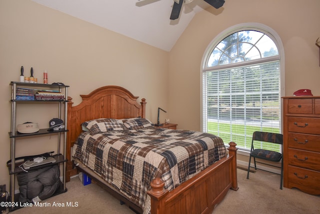 carpeted bedroom with ceiling fan and lofted ceiling