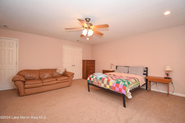 bedroom featuring carpet flooring, a closet, and ceiling fan