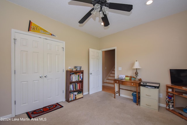 home office with light colored carpet and ceiling fan