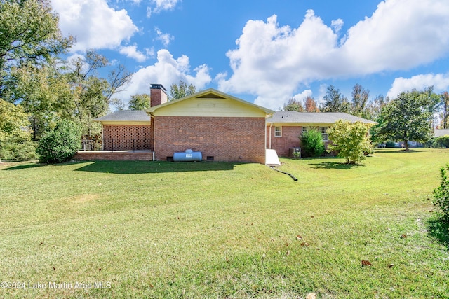 view of property exterior with a lawn