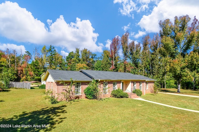 ranch-style home with a front lawn