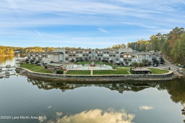 birds eye view of property with a water view