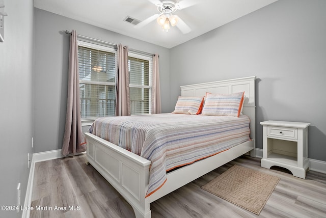 bedroom featuring light hardwood / wood-style floors and ceiling fan