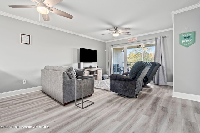 living room featuring light hardwood / wood-style floors, ceiling fan, and crown molding