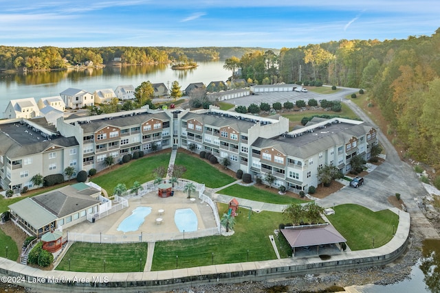 birds eye view of property with a water view