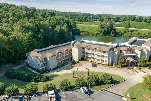 birds eye view of property with a water view