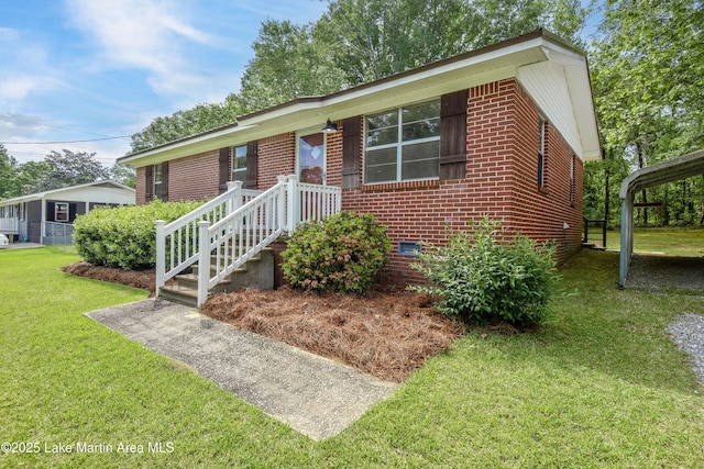 ranch-style house with crawl space, brick siding, and a front yard