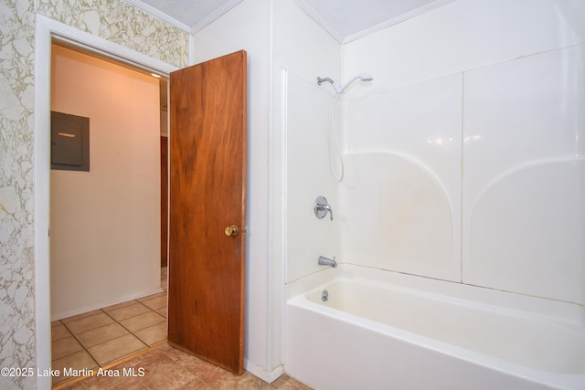 bathroom featuring electric panel, washtub / shower combination, tile patterned flooring, and crown molding