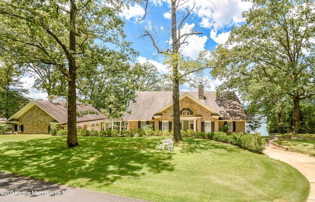 new england style home with a front yard