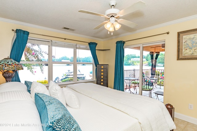 tiled bedroom with a textured ceiling, access to outside, and crown molding