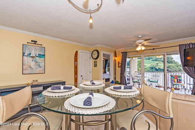 dining room featuring ceiling fan, crown molding, and a textured ceiling