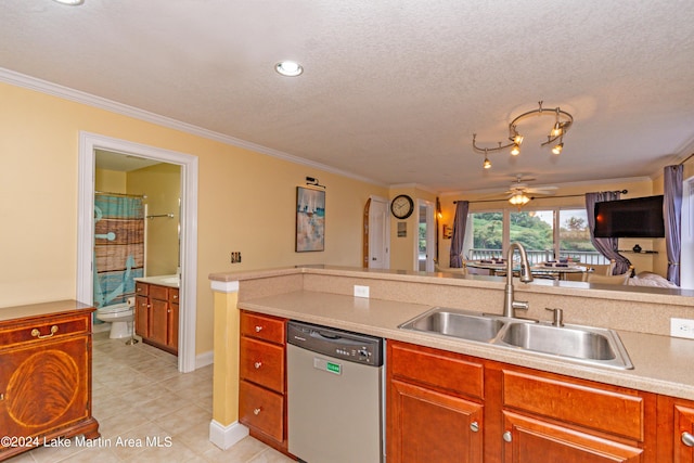 kitchen featuring ceiling fan, dishwasher, sink, crown molding, and a textured ceiling