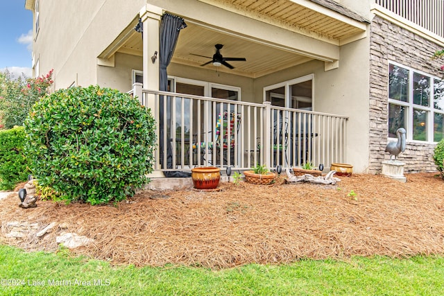 exterior space featuring ceiling fan and a balcony