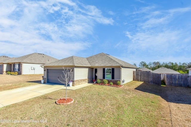 ranch-style house featuring a front yard, concrete driveway, fence, and an attached garage