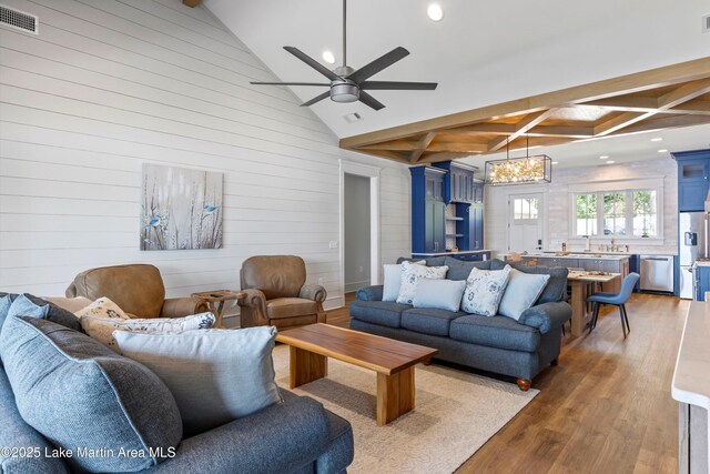 116 Water Oak Ln, Jacksons Gap, AL 36861 - living room with light wood-style flooring, a chandelier, recessed lighting, beam ceiling, and ceiling fan