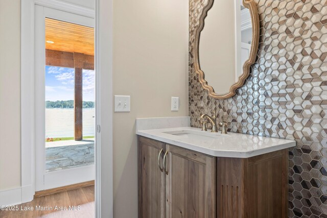 116 Water Oak Ln, Jacksons Gap, AL 36861 - bathroom featuring vanity, a water view, and wood finished floors