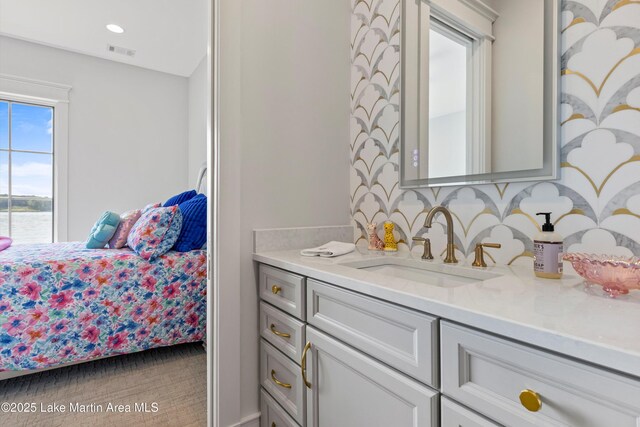 116 Water Oak Ln, Jacksons Gap, AL 36861 - bathroom featuring vanity, tasteful backsplash, and a water view