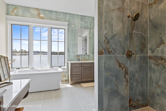 116 Water Oak Ln, Jacksons Gap, AL 36861 - full bath with vanity, tile patterned flooring, walk in shower, a soaking tub, and tile walls
