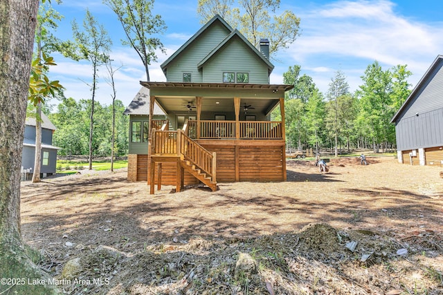 189 Magnolia Way, Dadeville, AL 36853 - view of front of home featuring a ceiling fan, stairway, and a chimney