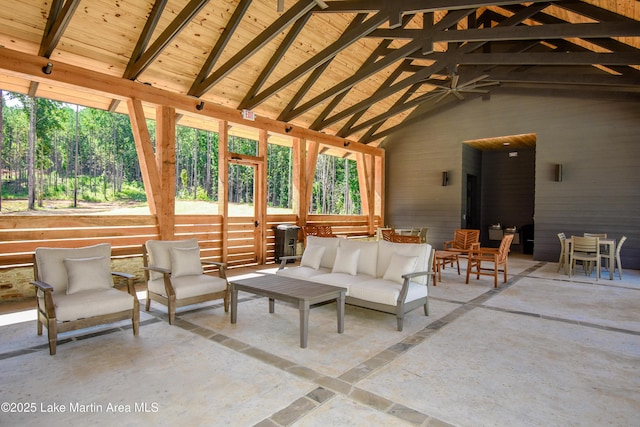 sunroom / solarium with lofted ceiling with beams and wooden ceiling