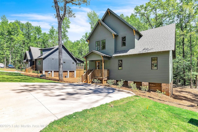 189 Magnolia Way, Dadeville, AL 36853 - view of front facade with roof with shingles and a front yard