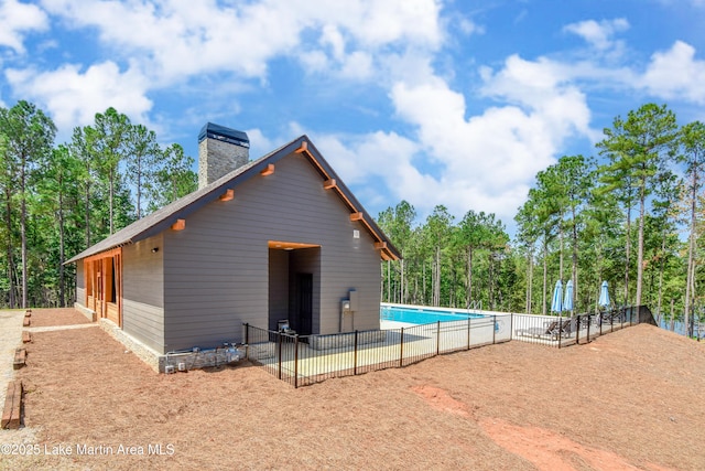 view of pool featuring a fenced in pool and fence