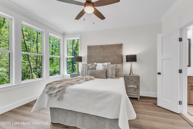 189 Magnolia Way, Dadeville, AL 36853 - bedroom featuring baseboards, wood finished floors, ornamental molding, and ceiling fan