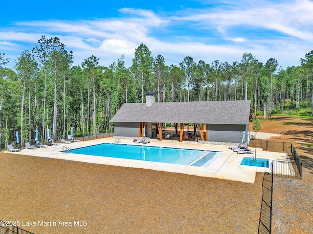 189 Magnolia Way, Dadeville, AL 36853 - community pool featuring a patio, an outbuilding, an exterior structure, and a forest view