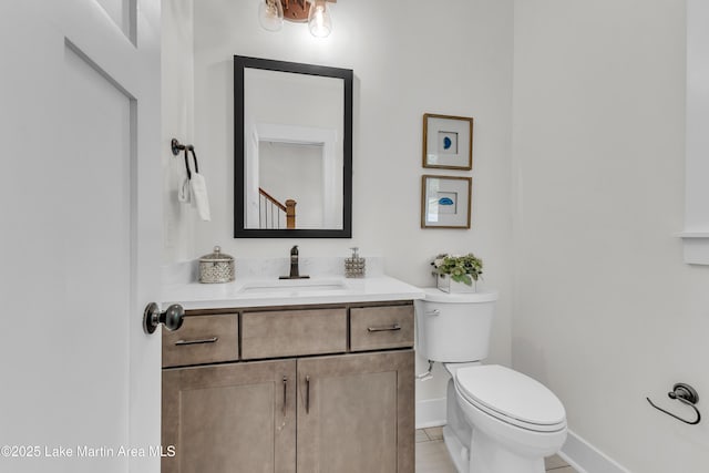 189 Magnolia Way, Dadeville, AL 36853 - half bath with toilet, vanity, baseboards, and tile patterned floors