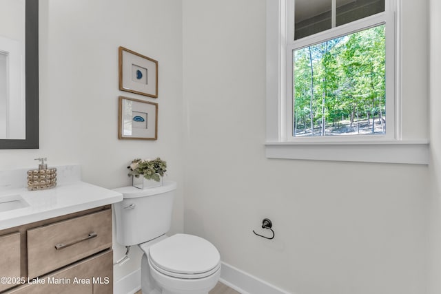 189 Magnolia Way, Dadeville, AL 36853 - half bathroom with vanity, baseboards, and toilet