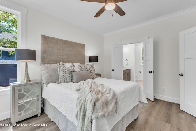 189 Magnolia Way, Dadeville, AL 36853 - bedroom with wood finished floors, crown molding, ensuite bathroom, baseboards, and a ceiling fan