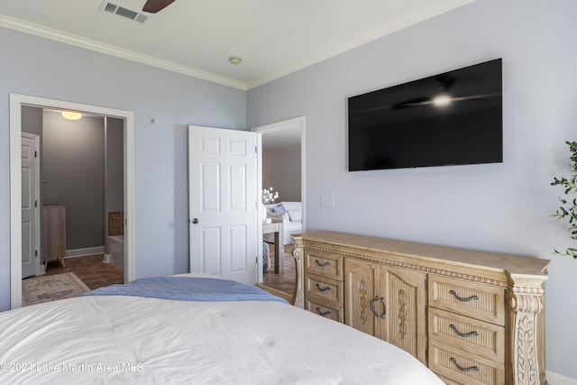 bedroom with ensuite bathroom and ornamental molding