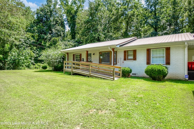 ranch-style home featuring a porch and a front yard