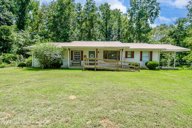 ranch-style house featuring a front lawn and covered porch