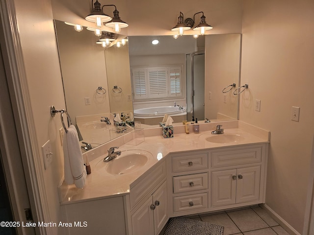 67 Lakeview Dr Unit 10H, Alexander City, AL 35010 - bathroom with tile patterned flooring, double vanity, a garden tub, and a shower stall