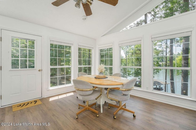 sunroom / solarium with ceiling fan and lofted ceiling