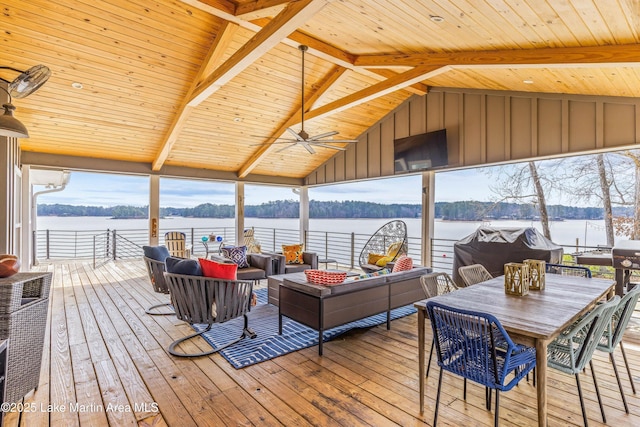 wooden deck featuring a ceiling fan and an outdoor living space