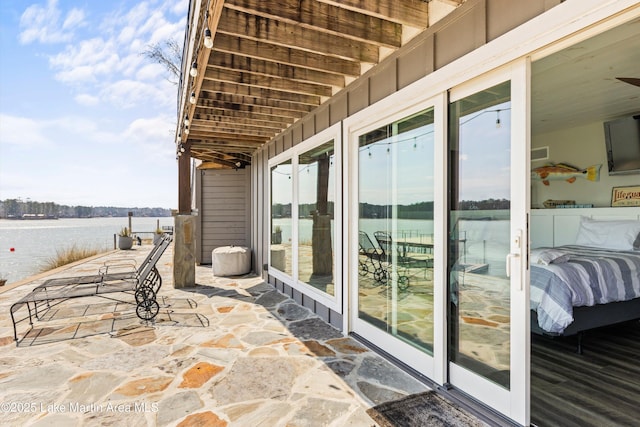 view of patio featuring a water view