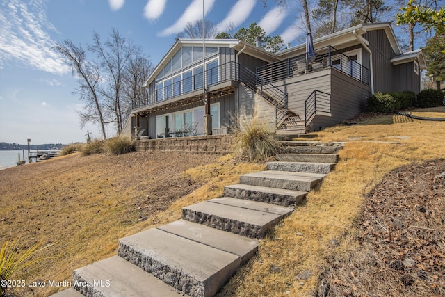 mid-century inspired home featuring stairs