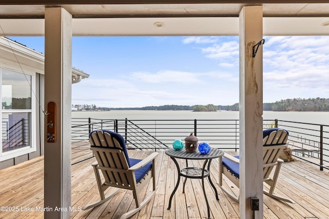 wooden deck with a water view