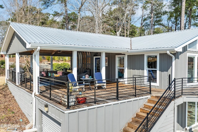 view of front of house featuring covered porch, metal roof, and board and batten siding