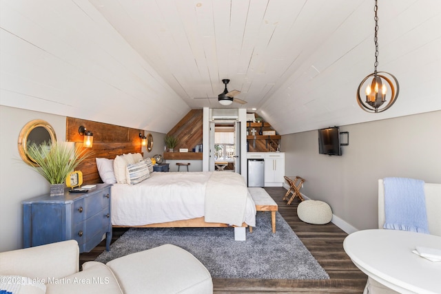 bedroom with dark wood finished floors, lofted ceiling, wood ceiling, refrigerator, and wood walls